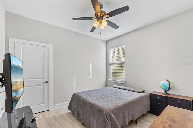 bedroom featuring ceiling fan and light wood-type flooring