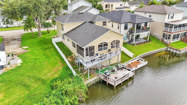 drone / aerial view with a water view