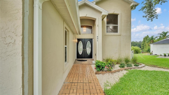 entrance to property with a yard