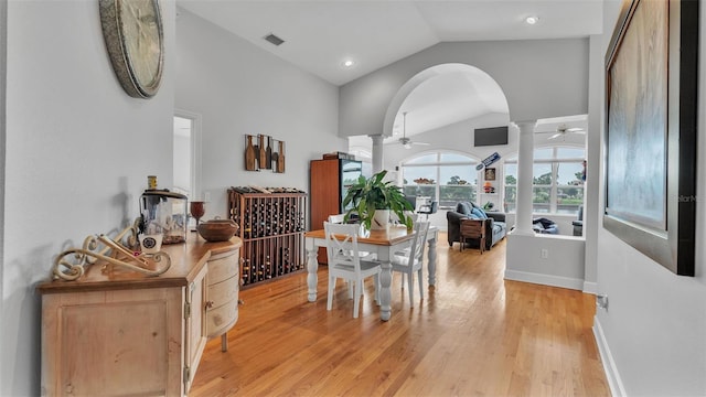 dining area featuring light hardwood / wood-style flooring, ceiling fan, and vaulted ceiling