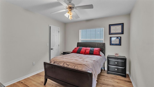 bedroom featuring light hardwood / wood-style flooring and ceiling fan