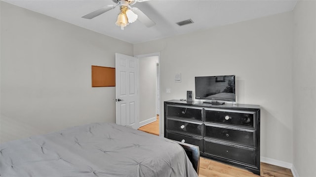 bedroom featuring light hardwood / wood-style flooring and ceiling fan