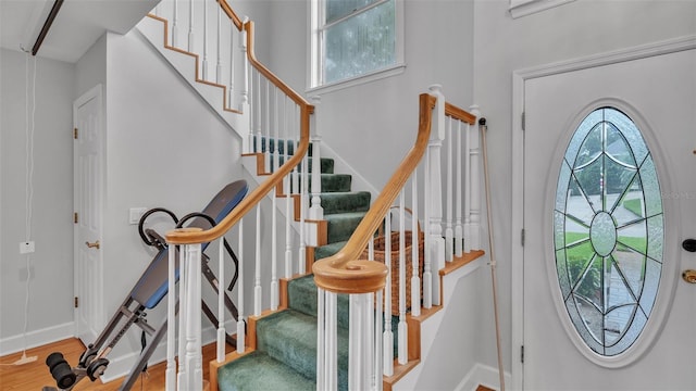 foyer with a healthy amount of sunlight and hardwood / wood-style floors