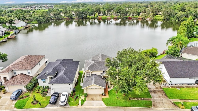 birds eye view of property with a water view