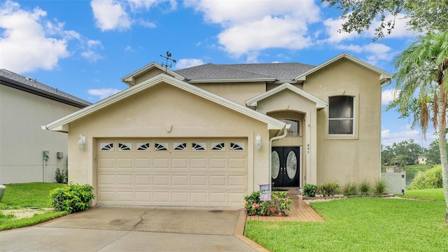 view of front of property with a garage and a front lawn