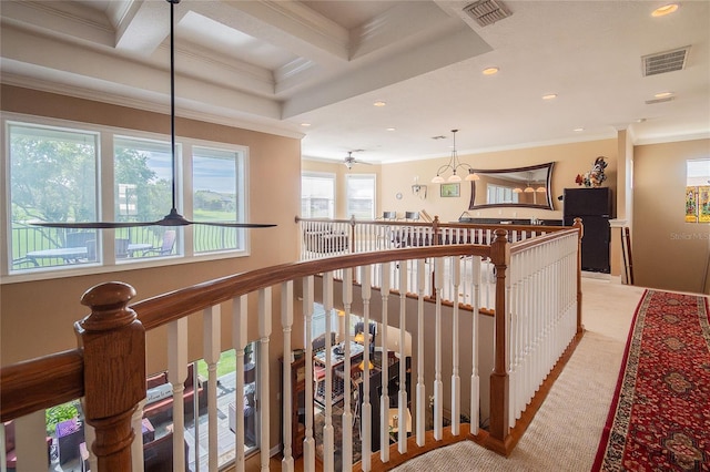 corridor featuring visible vents, an upstairs landing, carpet floors, and crown molding