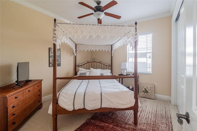 bedroom with light colored carpet, a ceiling fan, baseboards, and ornamental molding