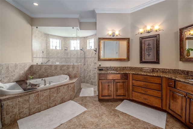 full bathroom featuring a garden tub, vanity, walk in shower, and ornamental molding
