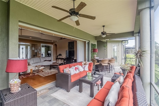 view of patio featuring ceiling fan and outdoor lounge area