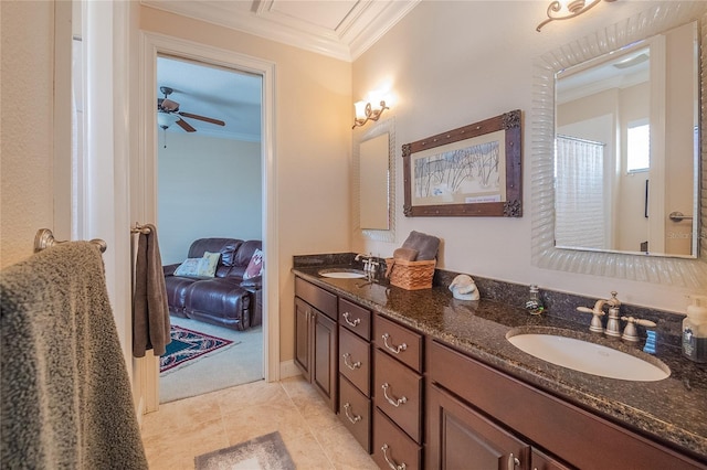 bathroom featuring a sink, ornamental molding, double vanity, and ceiling fan