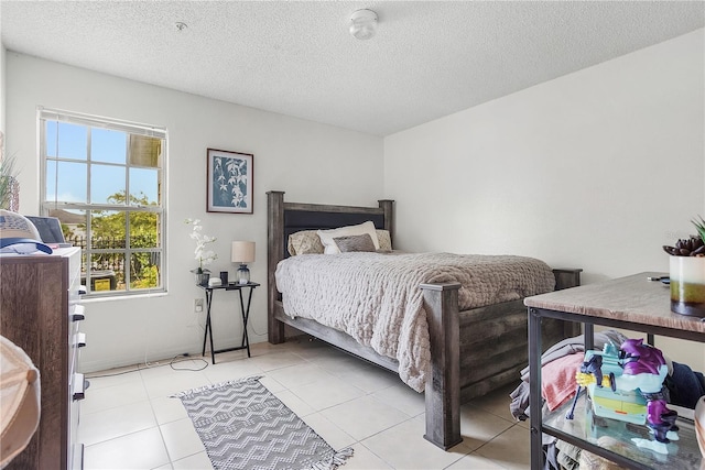 4255 Summer Landing Dr Unit 106, Lakeland, FL 33810 - bedroom with a textured ceiling and light tile patterned floors