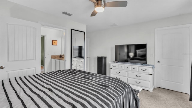 bedroom featuring light colored carpet, visible vents, and ceiling fan