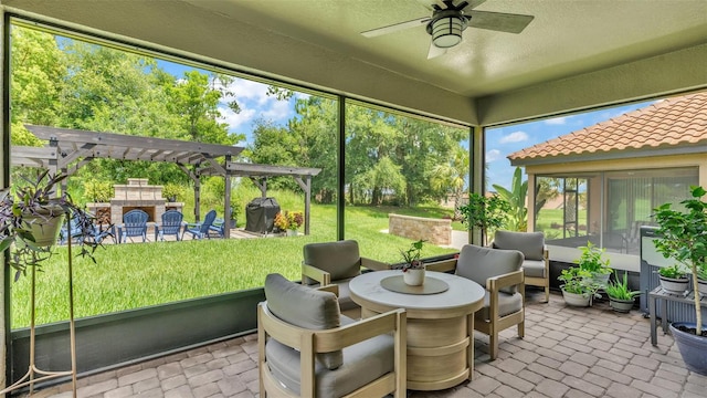 sunroom with a ceiling fan