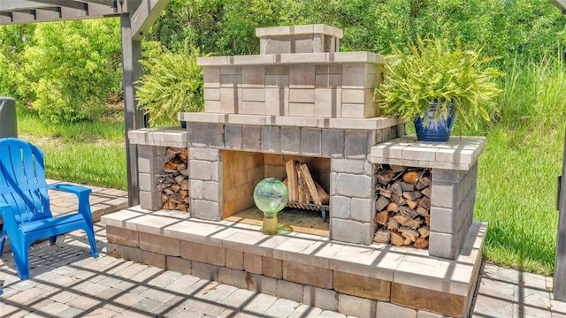 view of patio / terrace with an outdoor stone fireplace