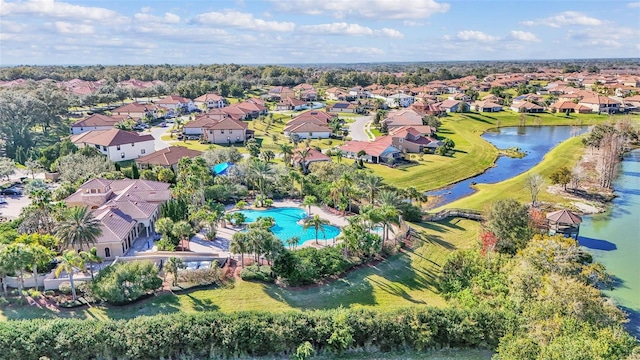 drone / aerial view with a residential view and a water view