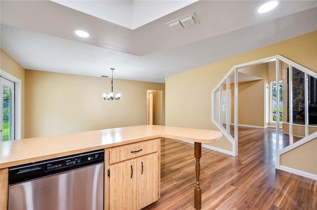 kitchen with dark wood-type flooring, light brown cabinetry, an inviting chandelier, decorative light fixtures, and dishwasher