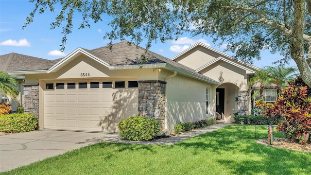 single story home with a front lawn and a garage