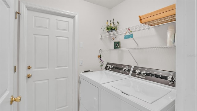 washroom featuring washer and dryer