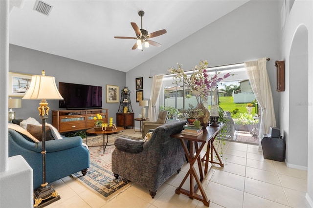 living room featuring ceiling fan, light tile patterned floors, and high vaulted ceiling