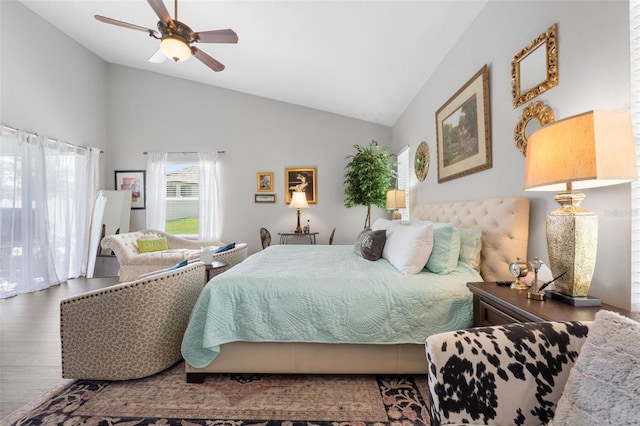 bedroom featuring ceiling fan, hardwood / wood-style flooring, and lofted ceiling