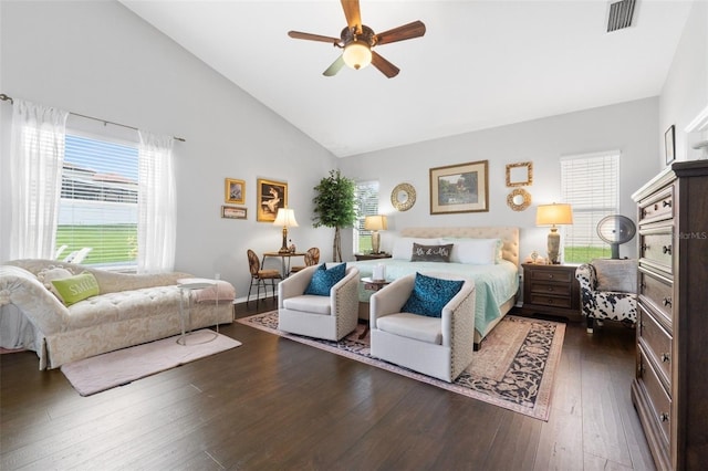 bedroom with lofted ceiling, dark hardwood / wood-style floors, and ceiling fan