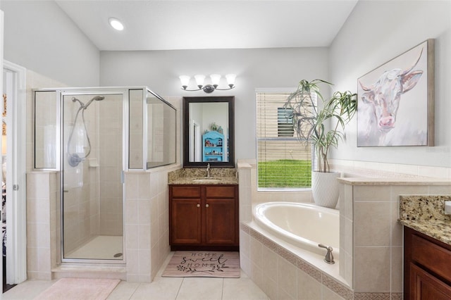 bathroom featuring separate shower and tub, tile patterned floors, and vanity