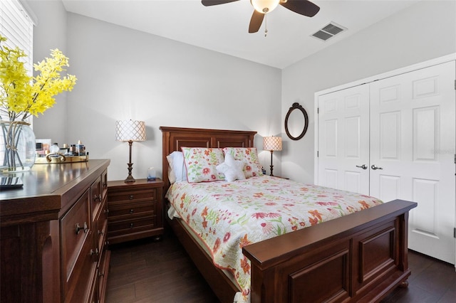 bedroom with ceiling fan, dark hardwood / wood-style floors, and a closet