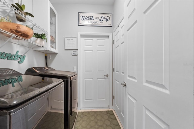 clothes washing area featuring washing machine and dryer