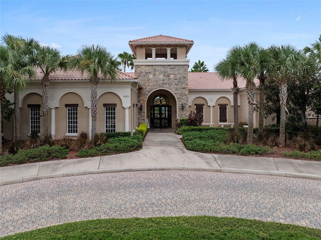 mediterranean / spanish home with french doors