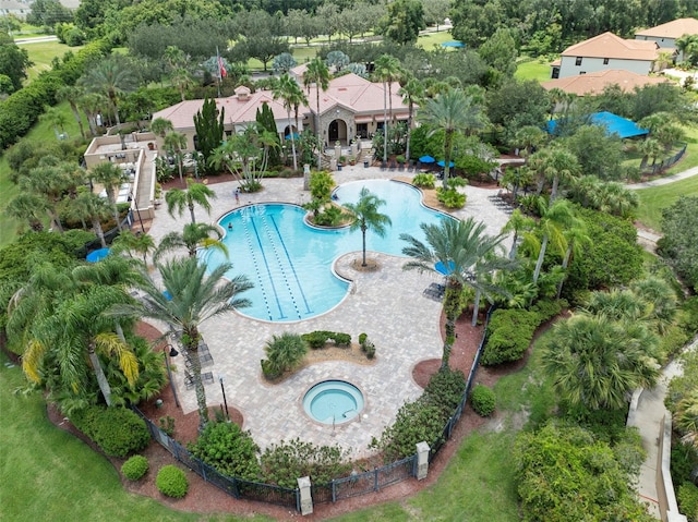 view of swimming pool with a patio area and a community hot tub