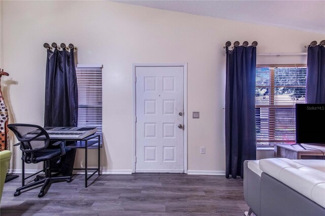 office space featuring lofted ceiling and hardwood / wood-style floors