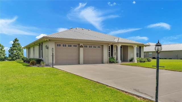 7884 N Lake Buffum Shores Rd, Fort Meade, FL 33841 - view of front of property featuring a garage and a front lawn