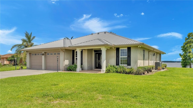 7884 N Lake Buffum Shores Rd, Fort Meade, FL 33841 - view of front of house featuring a garage and a front lawn