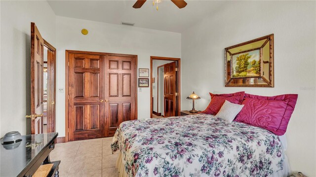 7884 N Lake Buffum Shores Rd, Fort Meade, FL 33841 - bedroom featuring a closet, light tile patterned floors, and ceiling fan