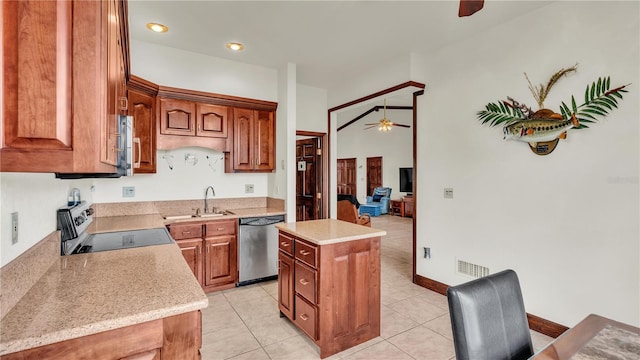 7884 N Lake Buffum Shores Rd, Fort Meade, FL 33841 - kitchen featuring appliances with stainless steel finishes, sink, light tile patterned floors, a kitchen island, and ceiling fan