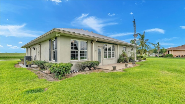 7884 N Lake Buffum Shores Rd, Fort Meade, FL 33841 - back of property featuring a yard and central air condition unit