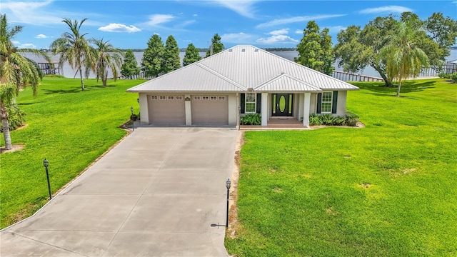 ranch-style house with a garage and a front yard