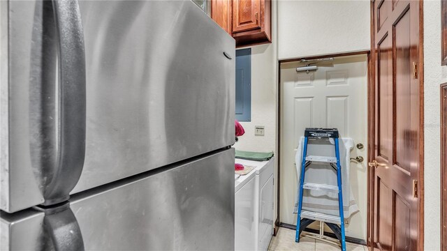 7884 N Lake Buffum Shores Rd, Fort Meade, FL 33841 - laundry room featuring separate washer and dryer and light tile patterned floors