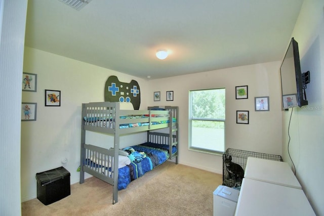 bedroom featuring light carpet