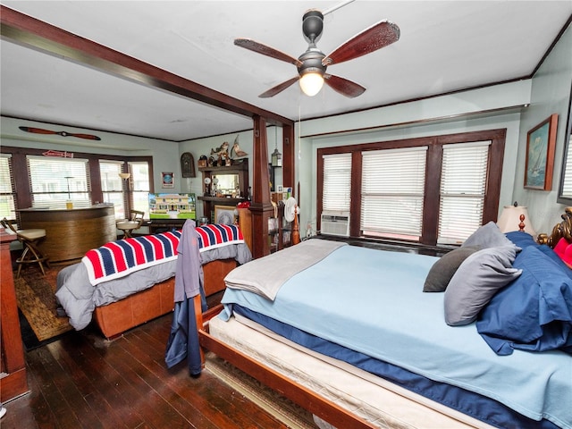 bedroom with dark hardwood / wood-style floors, cooling unit, and ceiling fan
