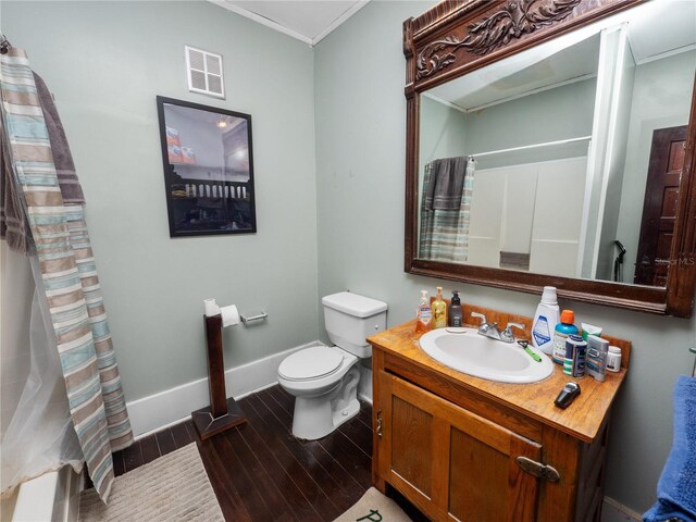 bathroom with vanity, hardwood / wood-style floors, ornamental molding, and toilet