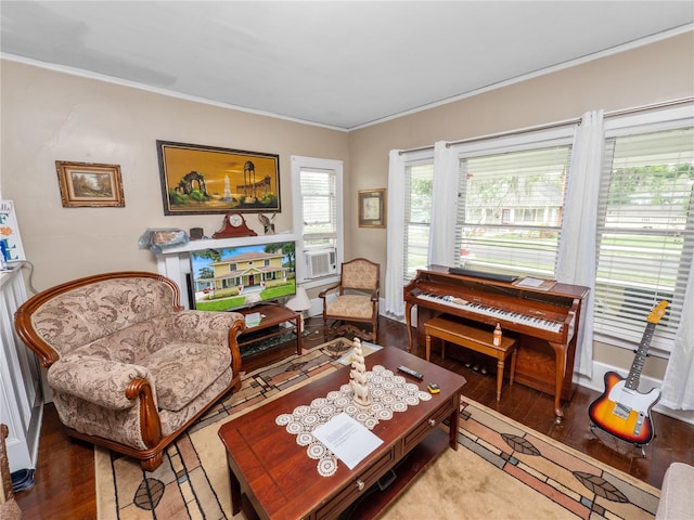 living room featuring hardwood / wood-style flooring, crown molding, and cooling unit