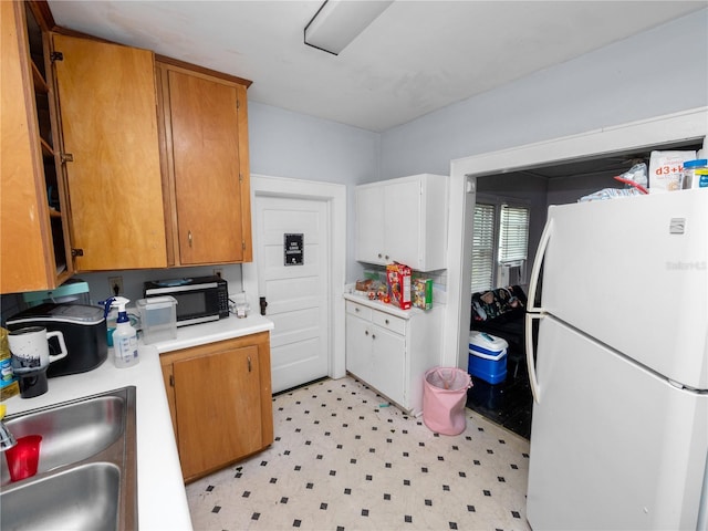 kitchen with white refrigerator and sink