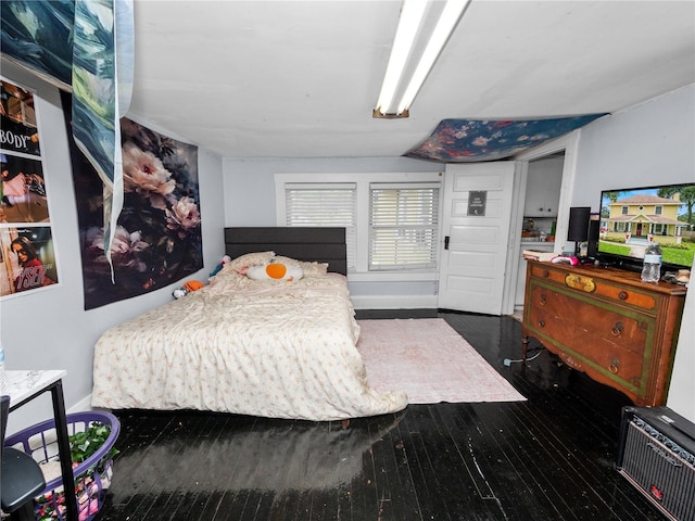 bedroom featuring dark hardwood / wood-style flooring