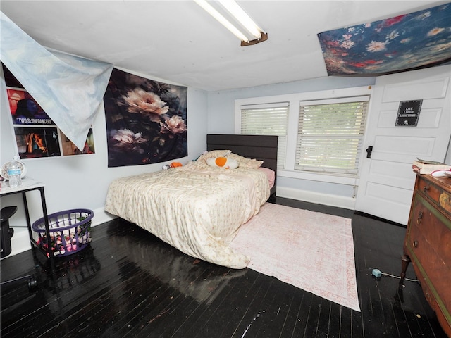 bedroom featuring dark wood-type flooring