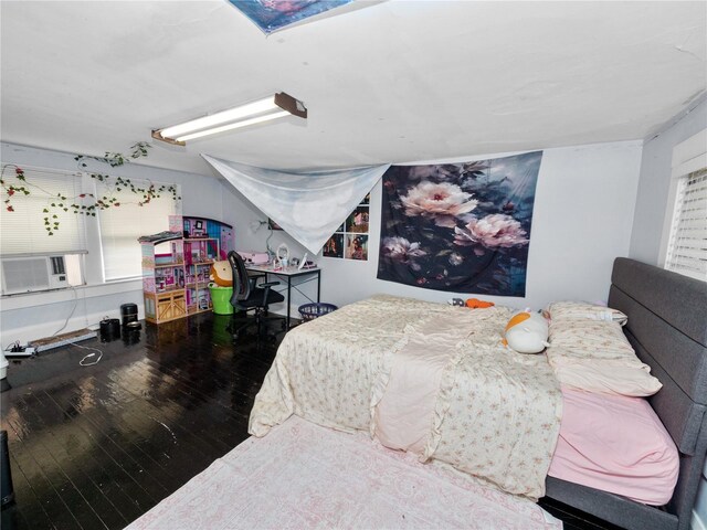 bedroom featuring cooling unit and wood-type flooring