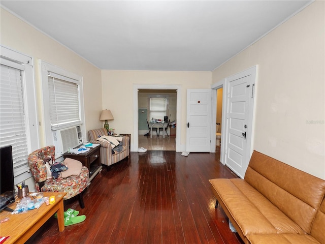 sitting room with cooling unit and dark hardwood / wood-style flooring