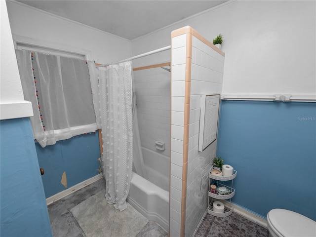 bathroom featuring shower / bathtub combination with curtain and toilet