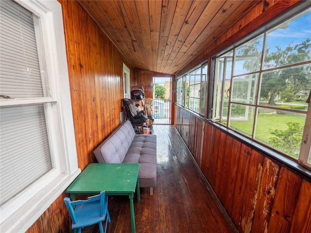 sunroom with wood ceiling and plenty of natural light