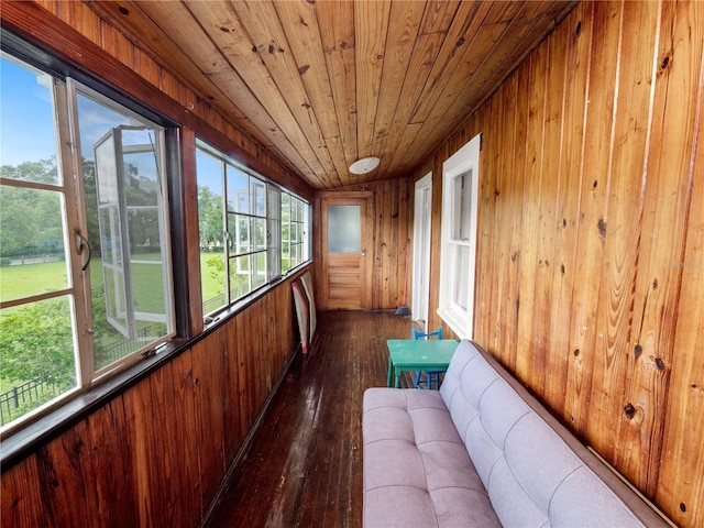 unfurnished sunroom featuring wood ceiling